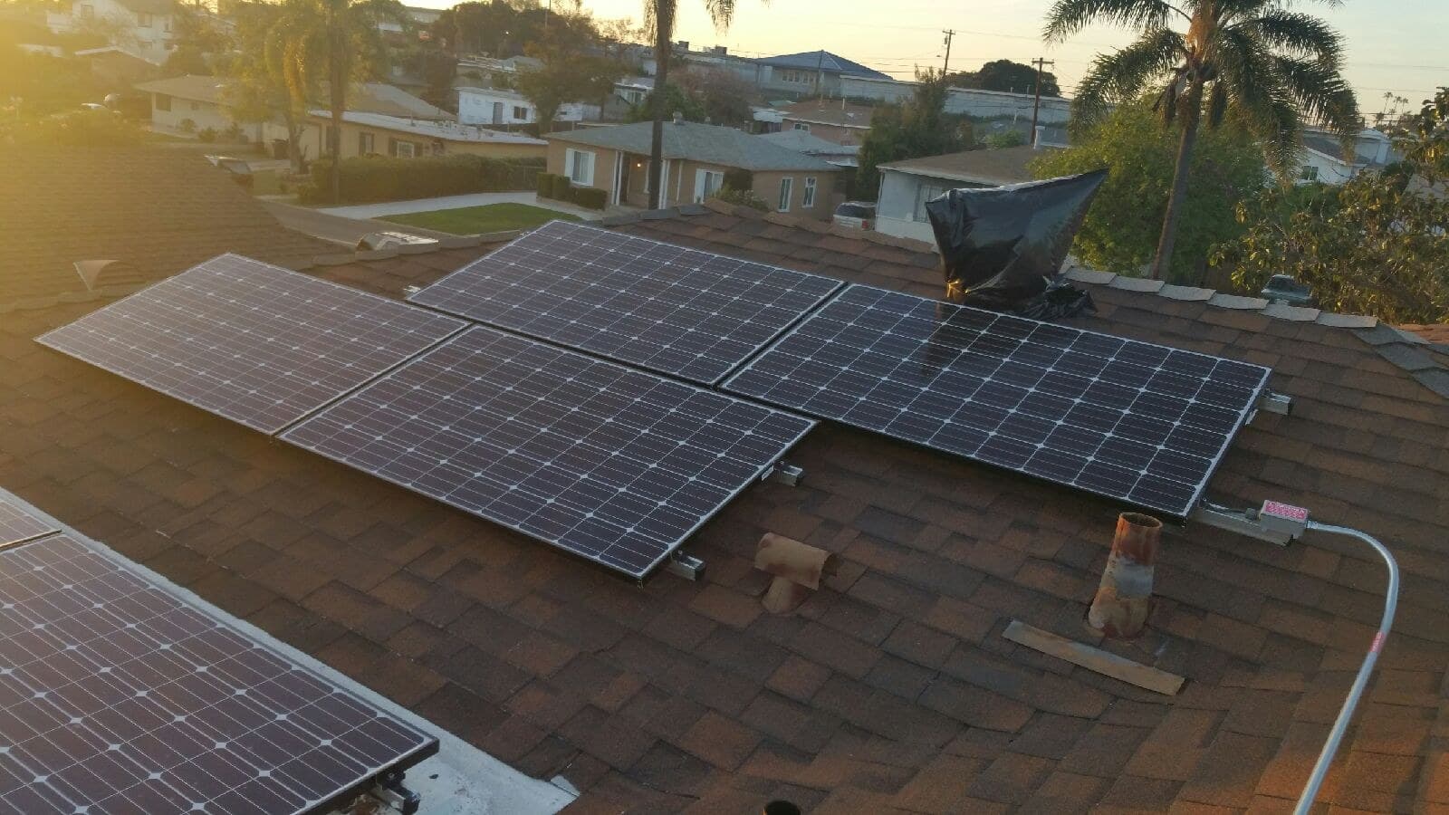 Rooftop solar arrays across a Southern California residential neighborhood